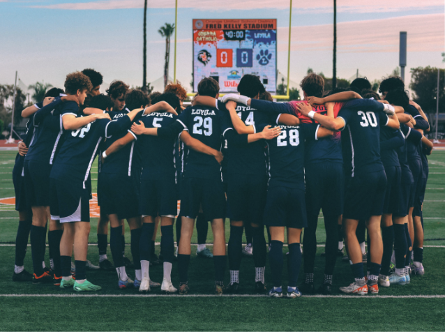 VARSITY TEAM PRAYS together before the CIF Southern Section Championship